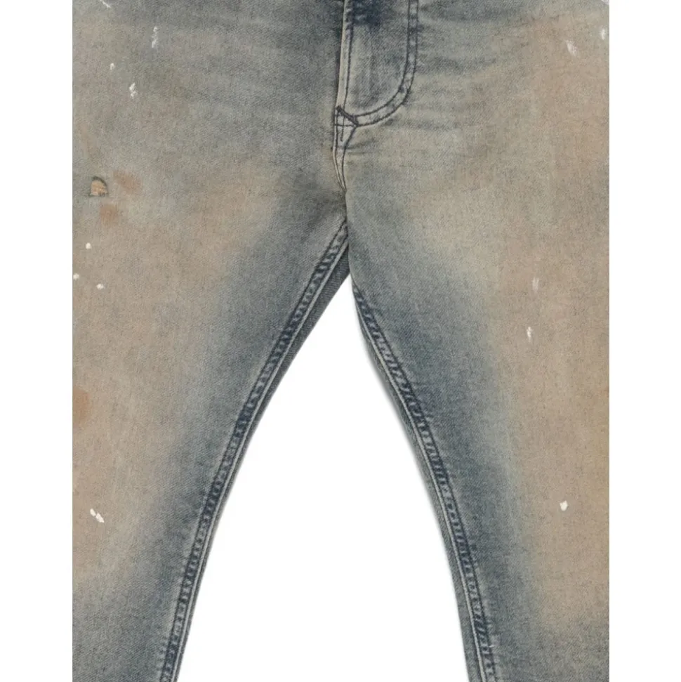 Jeans à effet usé