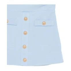 Jupe boutonnée avec poches passepoilées