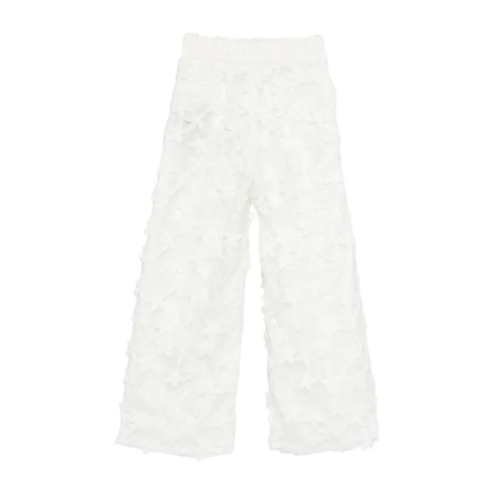 Pantalon en dentelle avec boutons dorés