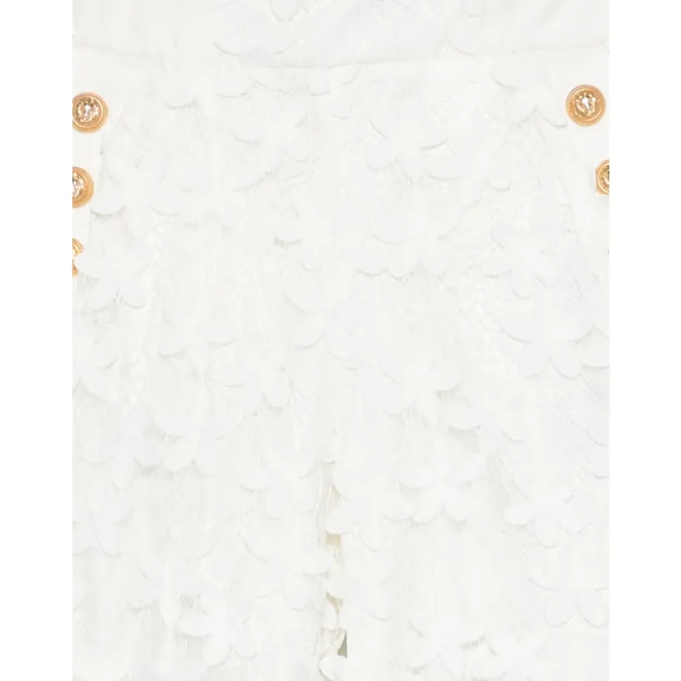 Pantalon en dentelle avec boutons dorés